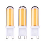 Trois ampoules LED G9 avec lumière blanc chaud et base en plastique blanc pour éclairage économique