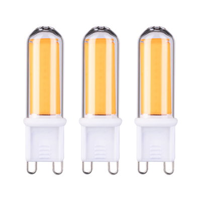 Three G9 LED bulbs with warm white light and white plastic base for energy-efficient lighting
