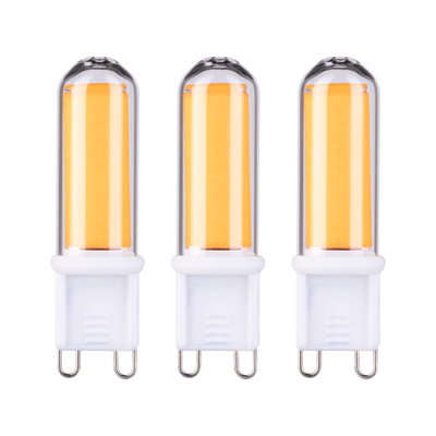 Three G9 LED bulbs with warm white light and white plastic base for energy-efficient lighting