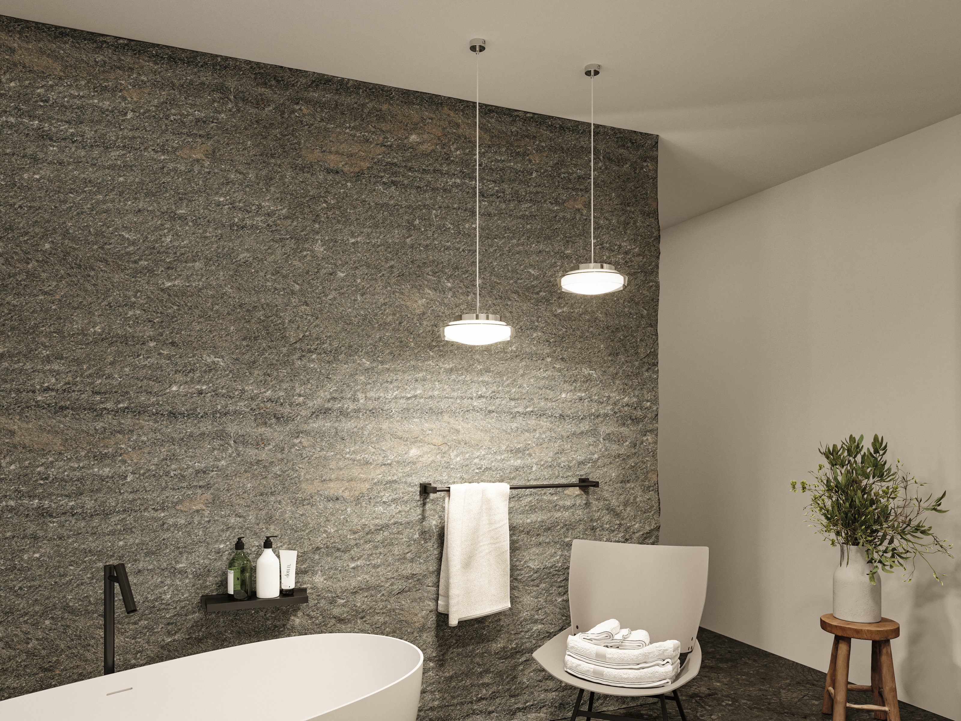 Modern bathroom lighting with two round chrome LED pendant lamps against a grey natural stone wall