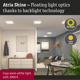 Living room with Atria Shine LED ceiling lights emitting warm white light and backlight technology
