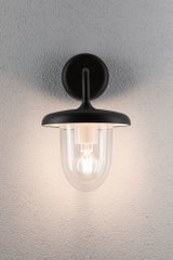 Sort væglampe med klart glas og synlig LED-pære til moderne indendørs belysning.