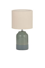 Table lamp with green ceramic base and beige fabric shade for cozy home lighting