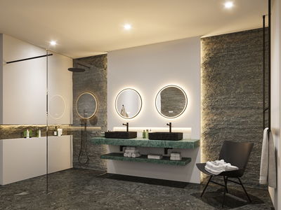 Moderne badkamer met groene marmeren wastafel, zwarte kommen en verlichte ronde spiegels, LED badkamerverlichting