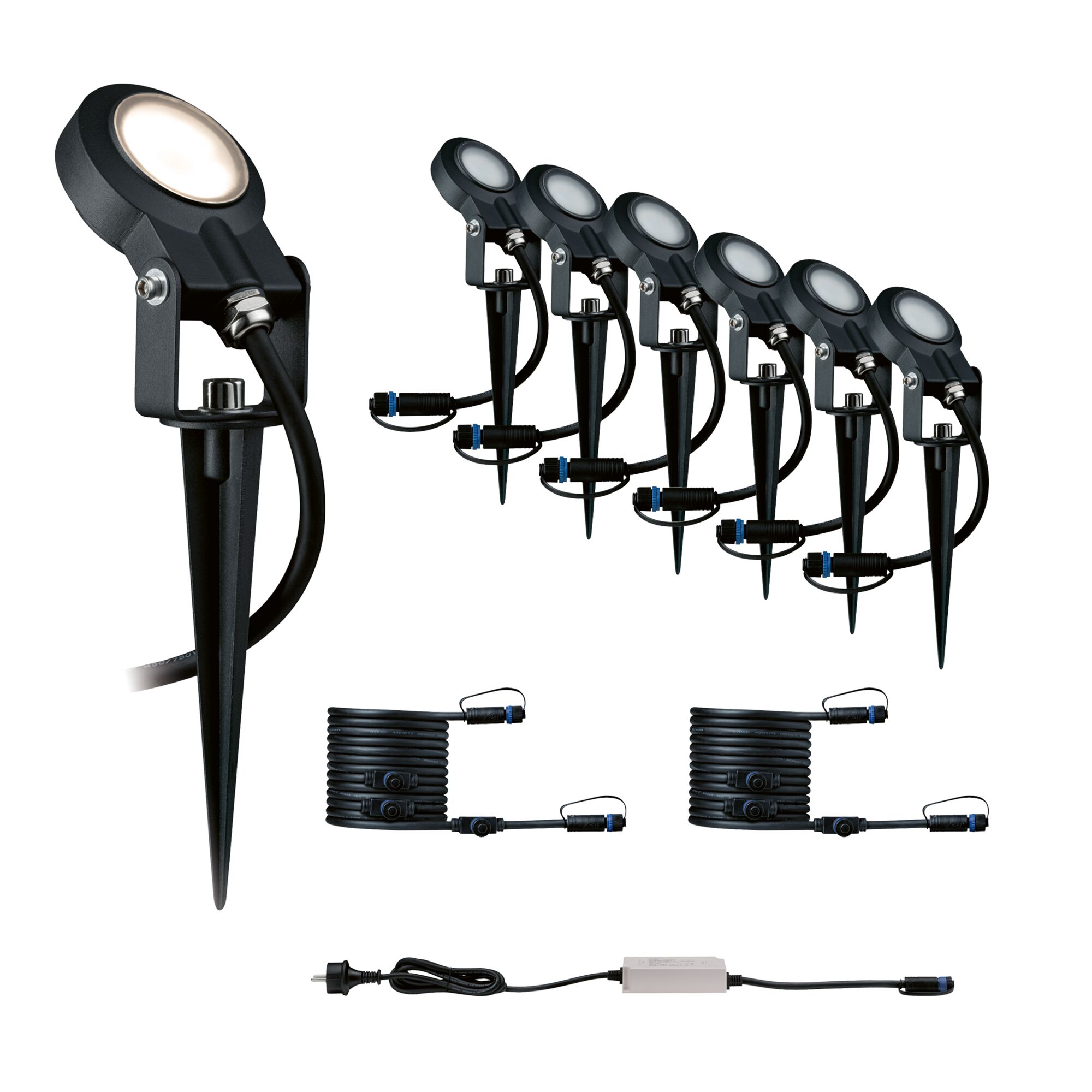 Set mit sechs schwarzen LED-Gartenstrahlern mit Erdspießen und Anschlusskabeln für Außenbeleuchtung.