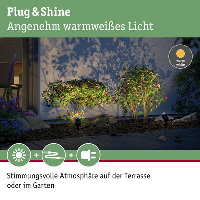 Warmweißes LED-Gartenlicht beleuchtet grüne Sträucher und schafft stimmungsvolle Terrasse und Gartenatmosphäre