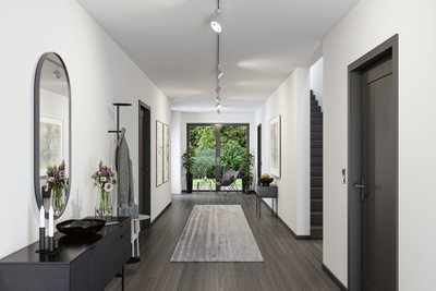 Moderner Flur mit grauem Boden, weißen Wänden, schwarzem Sideboard und Deckenstrahlern für Wohnraumbeleuchtung