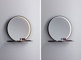 Ronde wandspiegel met zwart metalen frame en LED-verlichting in warm en koel wit met plank.