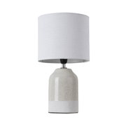 Table lamp with beige-white ceramic base and white fabric shade for stylish home lighting