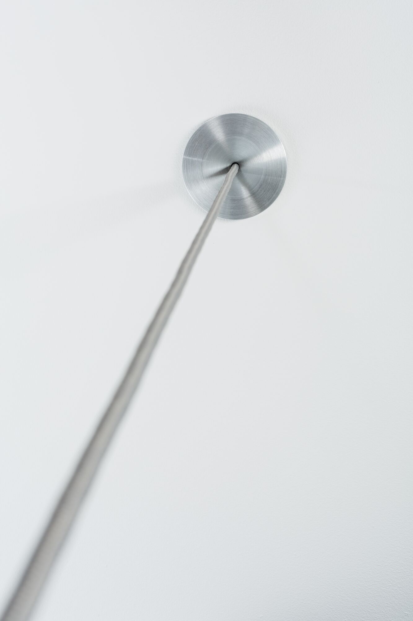 Ceiling with brushed aluminum canopy and grey cable for modern pendant light fixture