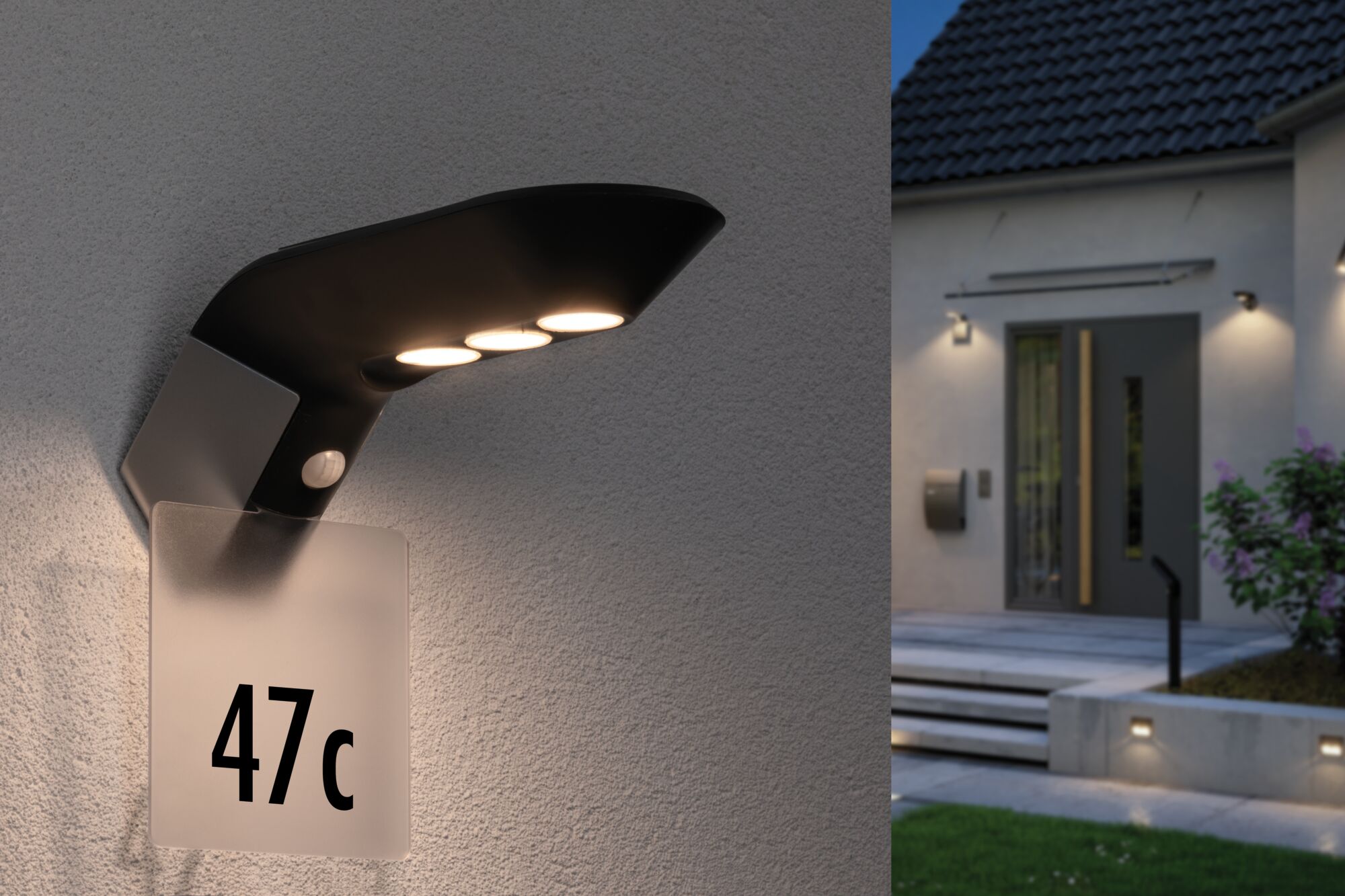 Moderne schwarze LED-Außenwandleuchte mit Bewegungsmelder und Hausnummernschild an grauer Wand