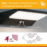 Black solar wall light with integrated motion sensor and automatic switching for outdoor use