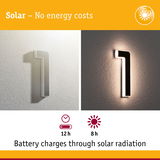 Solar-powered wall light shaped as number 1 in white and black with energy-saving LED illumination