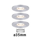 Three round recessed spotlights in brushed silver aluminum with 35 mm diameter