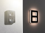 Modern rectangular LED wall light in white and black with indirect lighting for living spaces