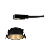Black recessed spotlight with gold reflector and matching black plastic connection cable for lighting