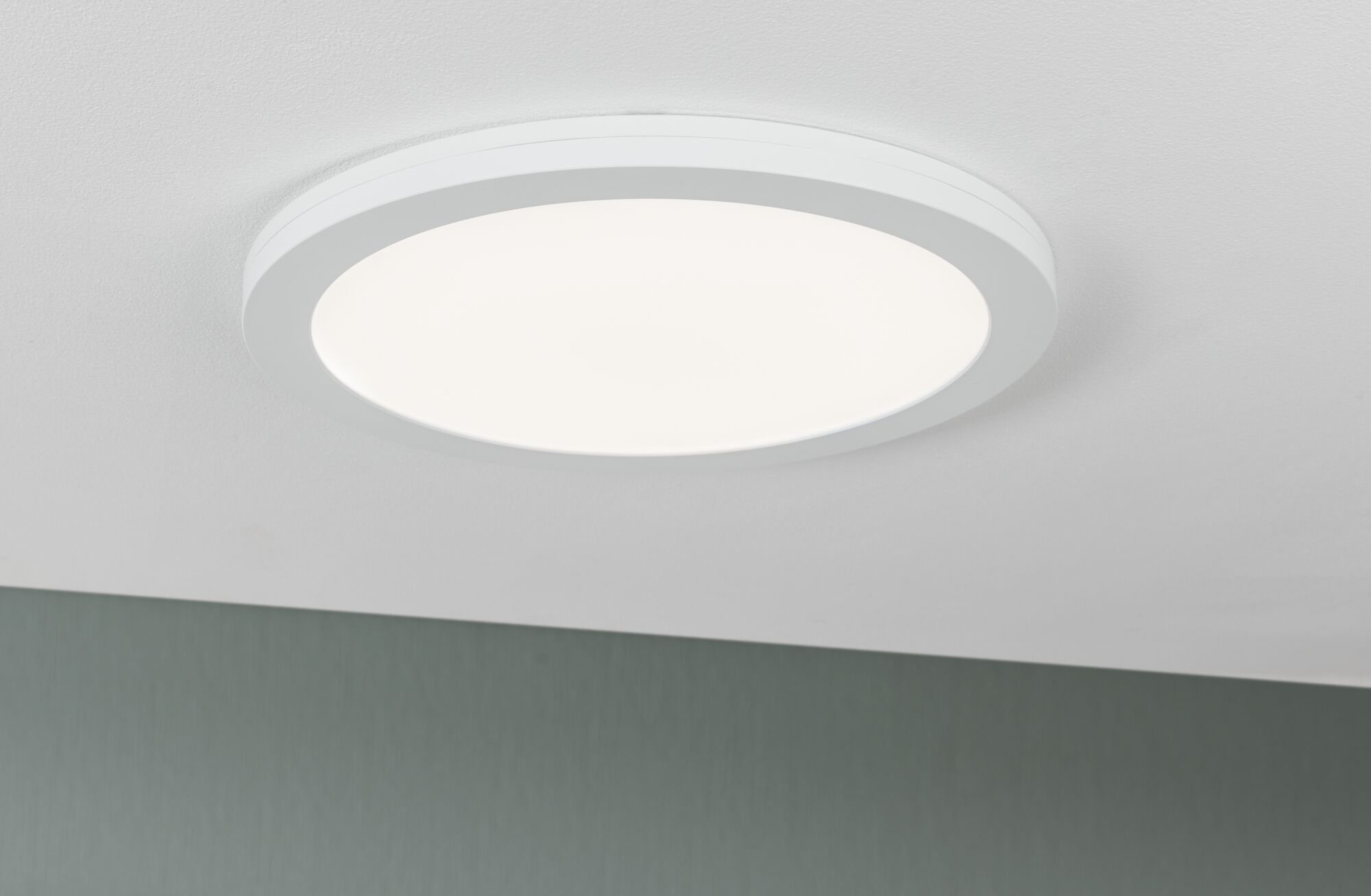 Round white LED ceiling light with matte frame for modern room lighting