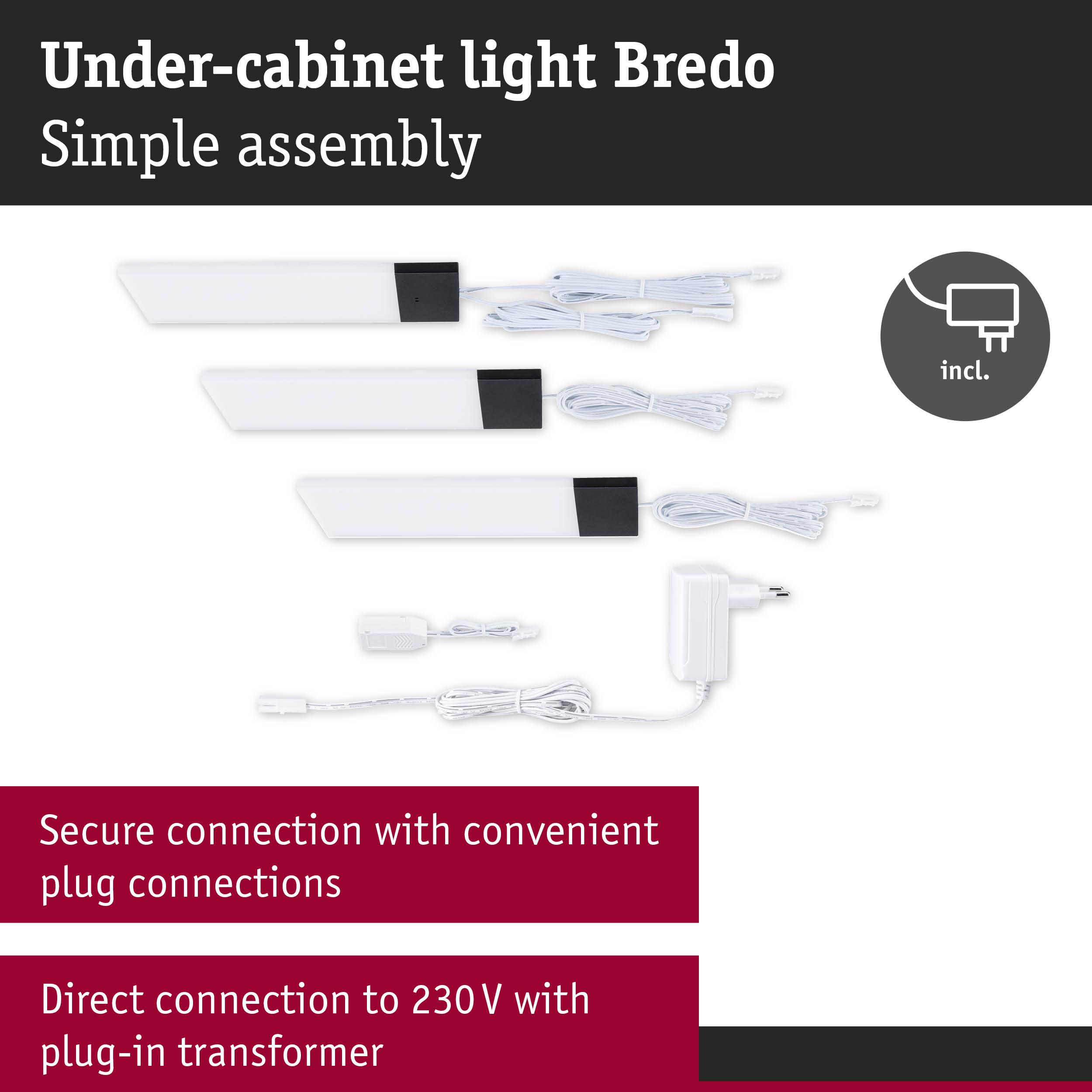 White Bredo under-cabinet lights with black ends, including power adapter and plug connections for easy installation