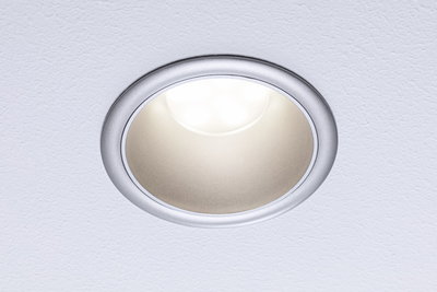 Round LED recessed spotlight with silver aluminum frame and warm white light for living spaces