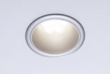 Round LED recessed spotlight with silver aluminum frame and warm white light for living spaces