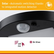 Black solar motion detector with 120° detection angle and 2 m range for outdoor lighting solutions