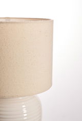 Beige linen lampshade with cream ceramic base for elegant home lighting and decor
