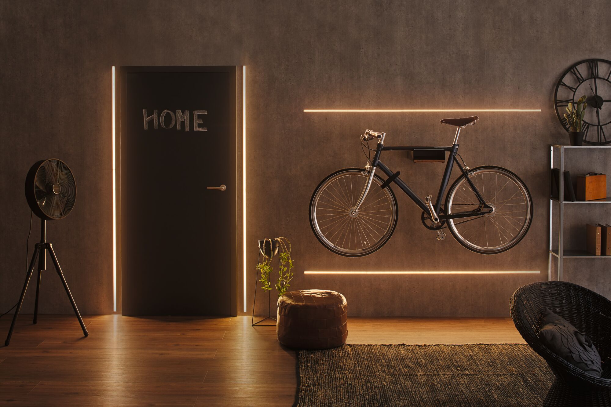 Modern living room with black bike on wall, LED light strips, and brown leather pouf on wooden floor