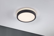 Runde Deckenleuchte mit schwarzem Stoffrand und warmweißem Licht für moderne Wohnräume