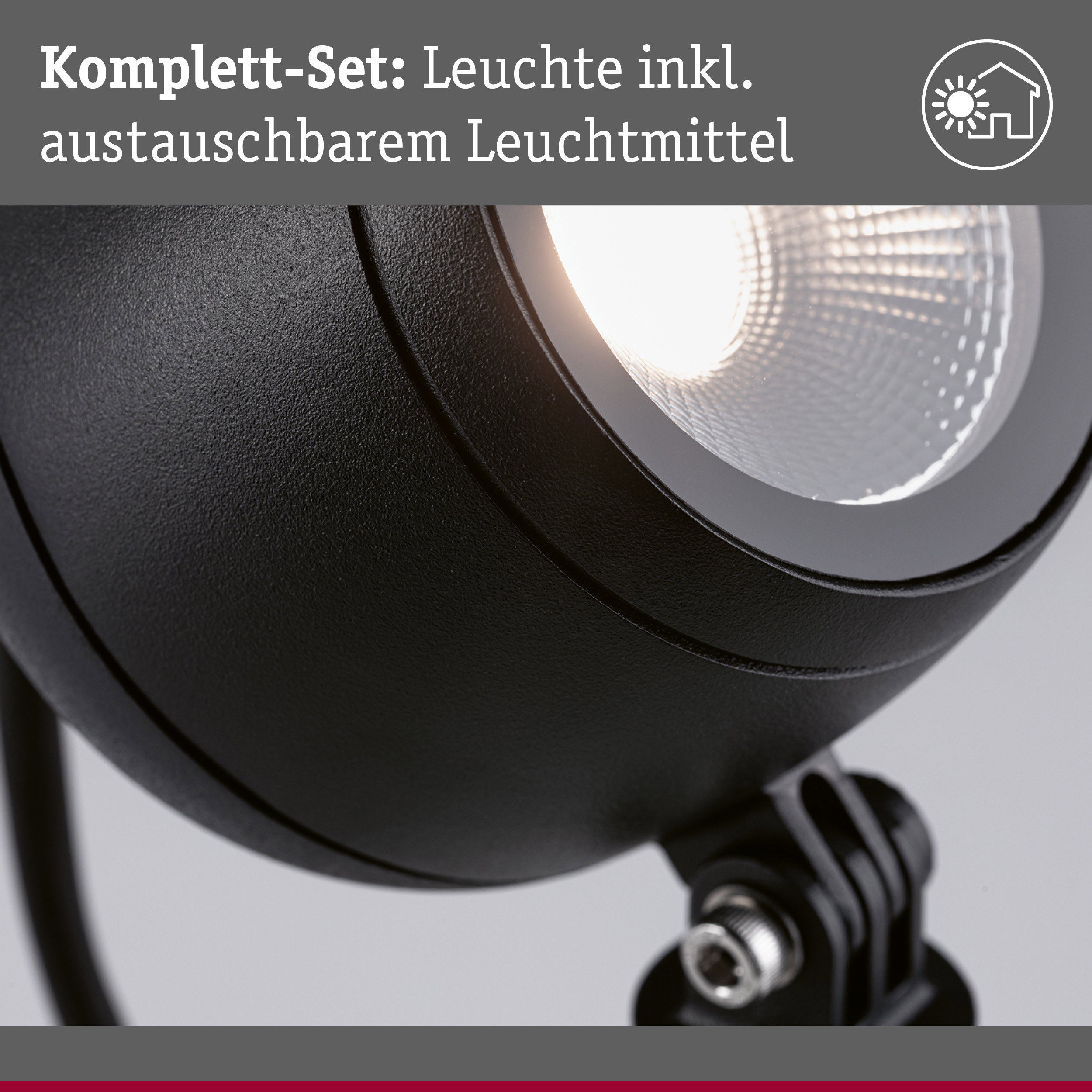 Nahaufnahme einer schwarzen Leuchte mit austauschbarem Leuchtmittel und mattem Gehäuse