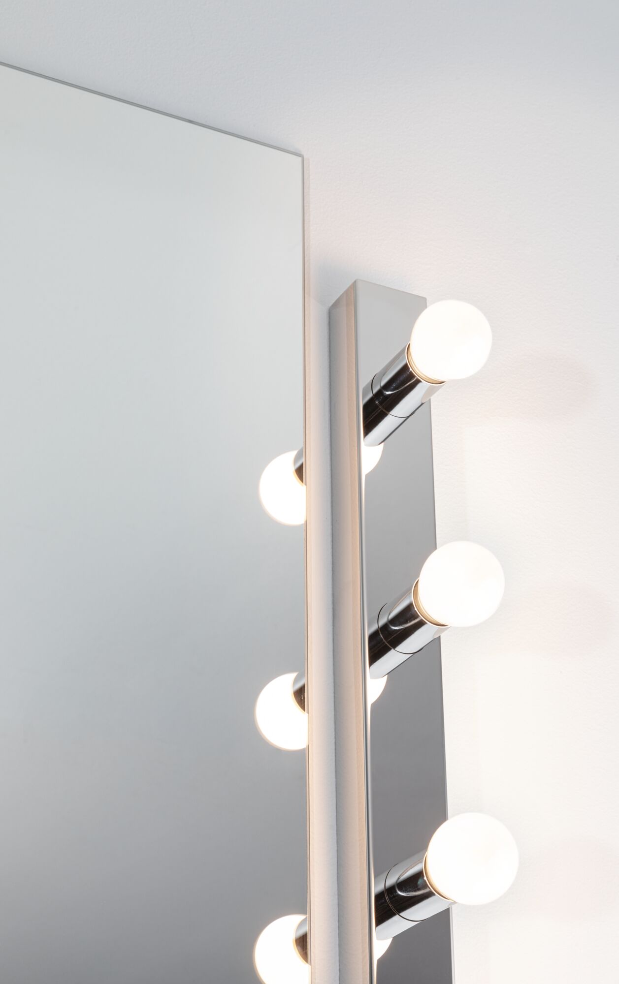 Modern chrome wall light with four round white LED bulbs for bathroom mirror lighting