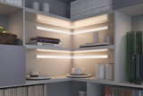 Modern white corner shelves with warm white LED light strips for stylish home lighting