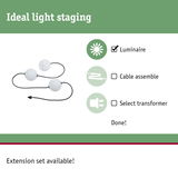 Three white globe luminaires with black cable for flexible light staging without cable or transformer.