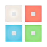 Four square LED wall lights in white, red, blue, and green with metal center for modern room lighting