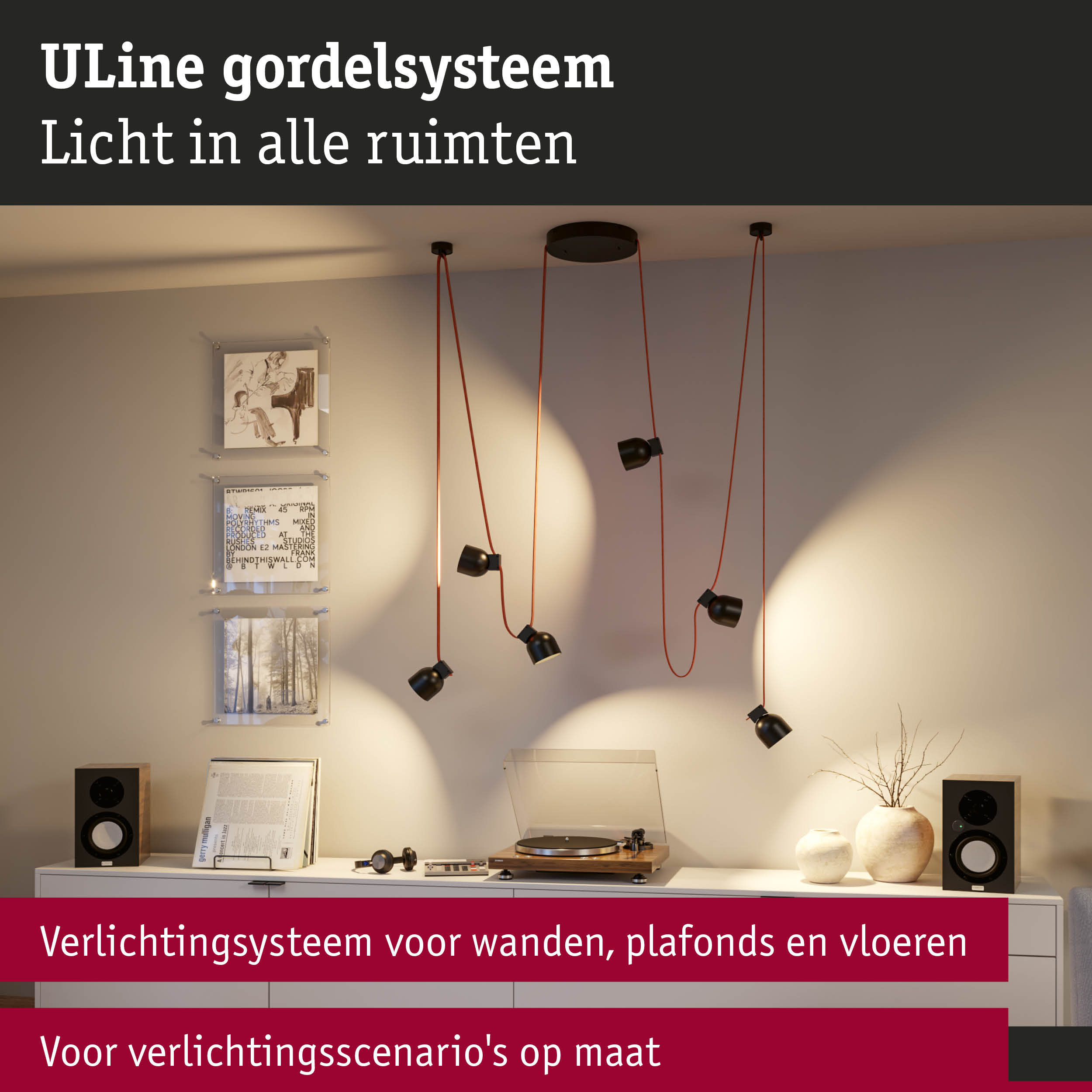 Zwart ULine hangverlichtingssysteem met rode kabels aan plafond in moderne woonkamer.