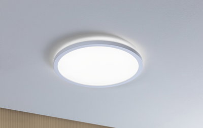Round white LED ceiling light made of plastic with warm white light for living spaces