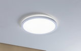 Round white LED ceiling light made of plastic with warm white light for living spaces
