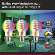 Three dimmable RGBW LED bulbs with tunable white feature in modern living room setting with green light