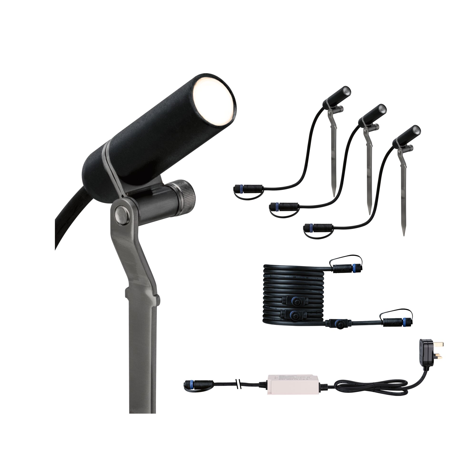 Black LED outdoor spotlight set with ground stakes, cable, and power supply for garden lighting.