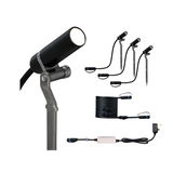 Black LED outdoor spotlight set with ground stakes, cable, and power supply for garden lighting.