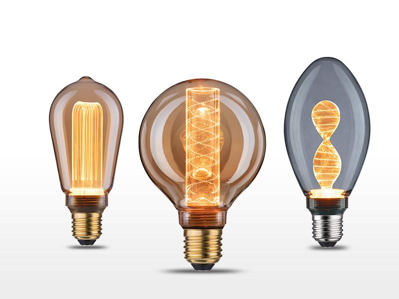 Tre dekorative LED-pærer med brunt glas og moderne filamentdesign til stemningsbelysning