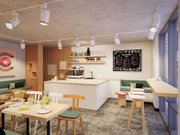 Modern room with white LED track spotlights on ceiling and cozy café decor featuring wood and green seating.