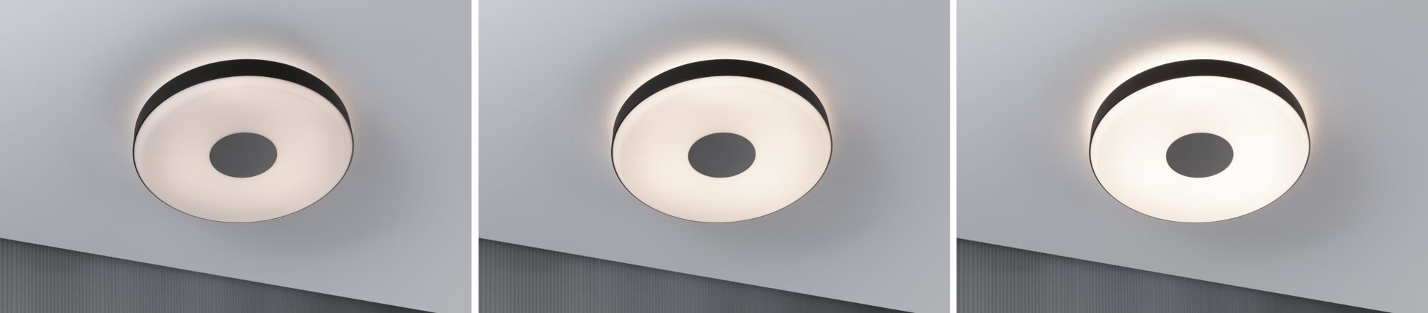 Three round ceiling lights with black trim and warm white light for modern interiors.
