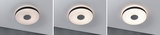 Three round ceiling lights with black trim and warm white light for modern interiors.