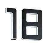 Modern house number 18 with black solar panels and white plastic frame for outdoor lighting