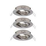 Three round recessed spotlights in brushed stainless steel with adjustable inner ring for accent lighting