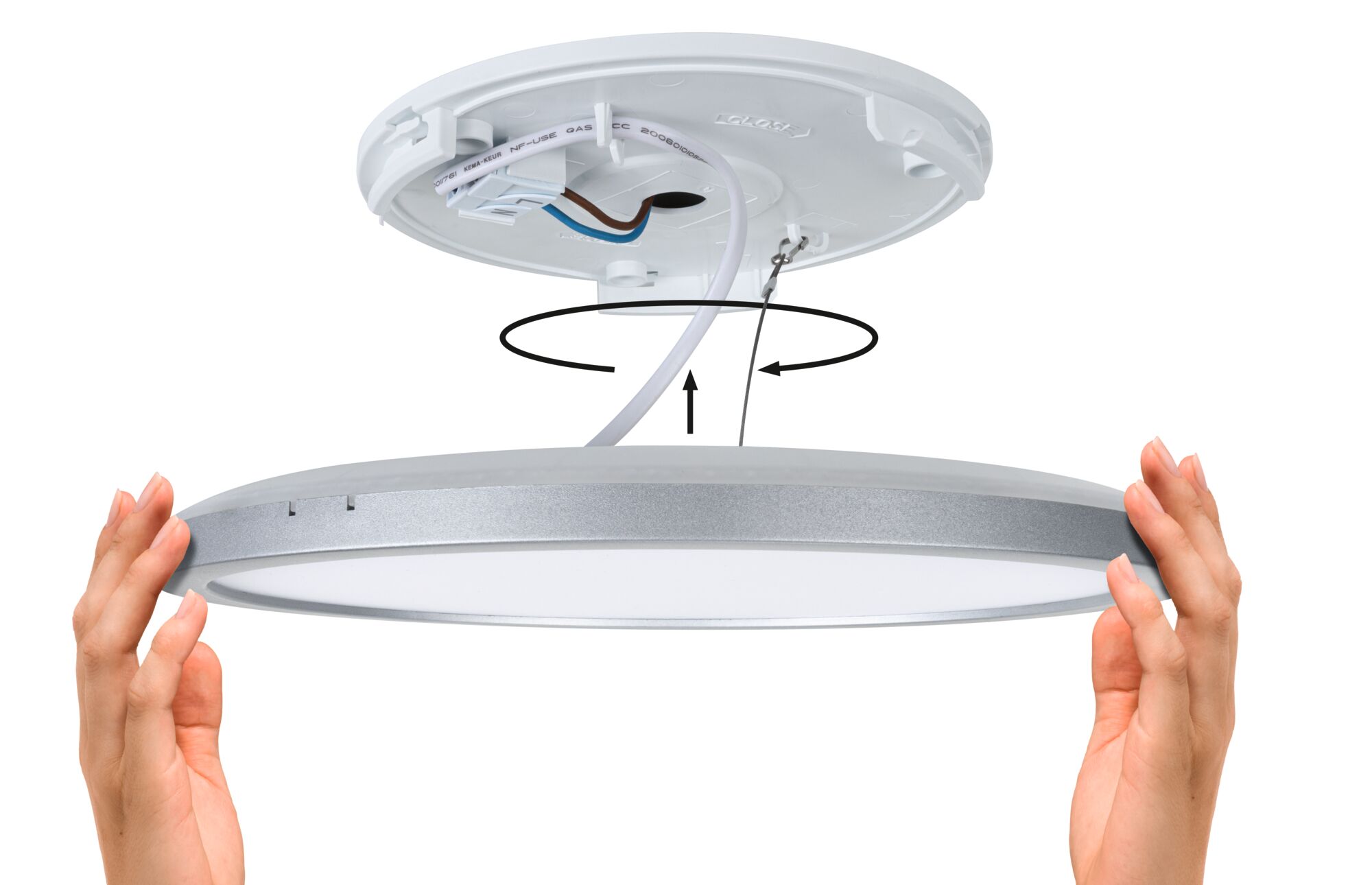 Installation of round ceiling light fixture in silver and white with wiring and twist-lock mechanism