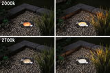 Four stainless steel recessed ground lights showing warm light colors 2000K and 2700K in gravel bed.