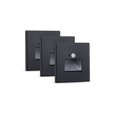 Set of three black metal LED stair lights with motion sensor for energy-efficient lighting
