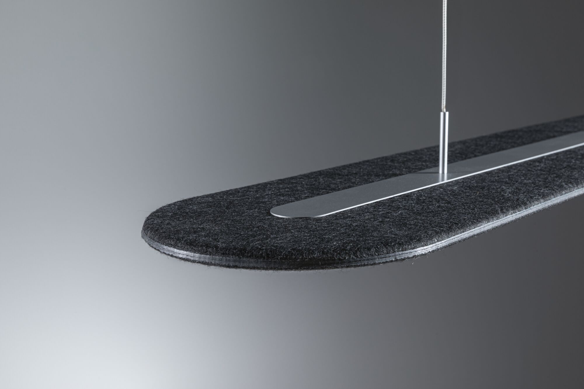 Modern pendant light with black felt and silver metal strip for stylish room lighting