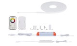 White LED strip with remote control, power supply and mounting accessories for versatile lighting